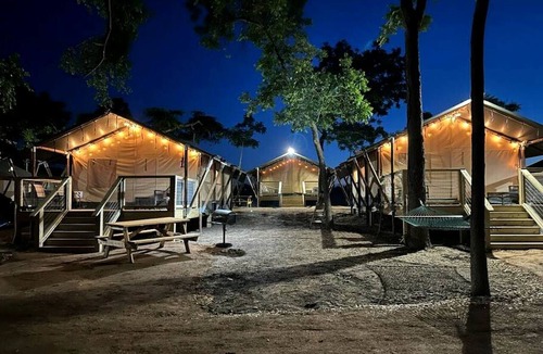 Prairie Lea RV Rental | Fully-Equipped Riverside Glamping Safari Tent on the San Marcos River, Texas