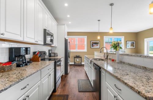 Kewadin House | Golf in Luxury - 4BDR Home on Agaming Golf Course - by Torch Lake