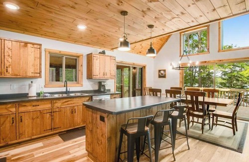Eagle River House | Gorgeous lake home with private pier, beach, firepit, deck, & grill + water toys