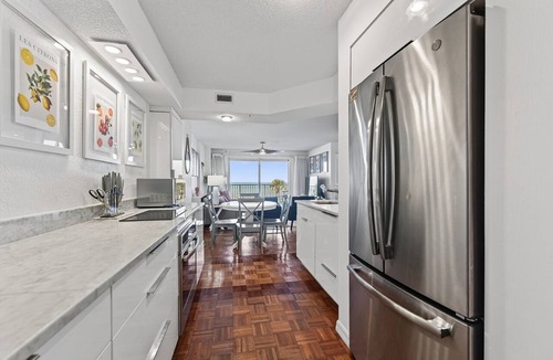 Seawinds Condo Condo | Ground floor direct oceanfront 2/2 with a balcony, heated pool, and garage parking