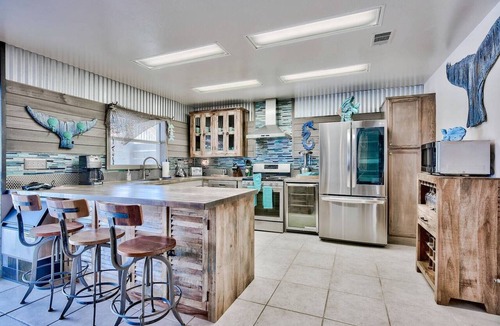Holiday Isle House | Harborfront Home with Pool, Dock & Tiki Cruise