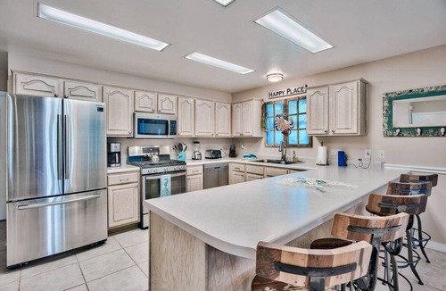 Holiday Isle House | Harborfront Home with Pool, Dock & Tiki Cruise