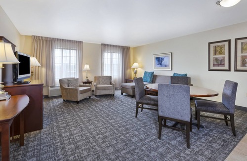 Okemos Condo | King Suite. Free Breakfast. Pool. Near Michigan State University.