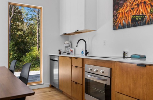Acme House | KOTI 6 (Two Bedroom) Traverse City's Scandinavian Cabins, vacation home on TART & mins to Traverse C.