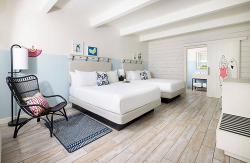 New Town Hotel | Laid-Back Luxe | Pools, Comfort Foods, Lawn Games & Shuttle to Fun