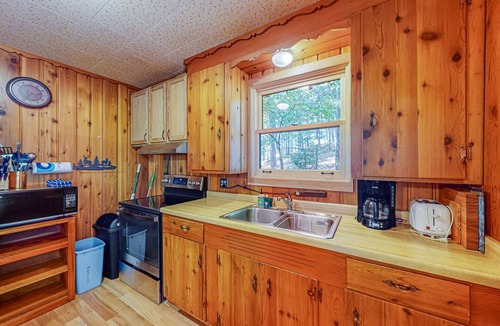 Boulder Junction Cabin | Lakefront cabin with private dock, boat, firepit, fish cleaning house, fireplace