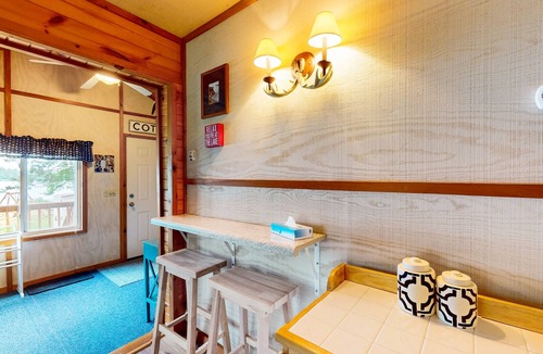 Eagle River House | Lakefront cottage w/a dock, shared furnished patio, firepit, & a paddleboat
