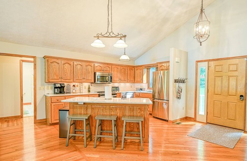 Livingston House | Lakefront home with deck, hot tub, game room, kayaks, & fireplace