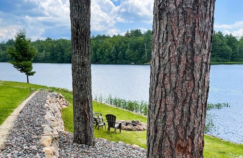 Sayner House | Lakefront home with private dock, deck, fireplace, firepit, canoe & paddleboat