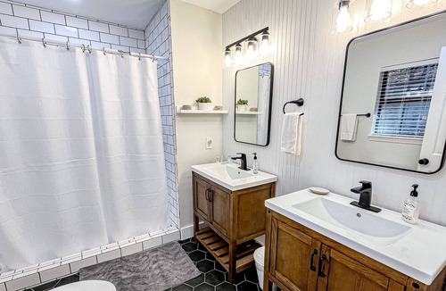 Brevard House | Lakefront home with views, dock, kayaks, outdoor pool & tennis - dog-friendly