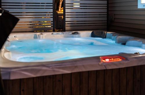 Charlevoix House | Lakefront Retreat, Mins to Dtown, Firepit, Hot Tub, Pet friendly!