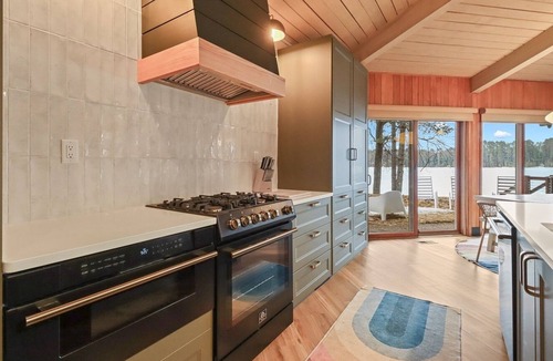 Eagle River Cabin | Lakefront Retreat with Sandy Beach, Swim Area & Relaxing Lakeside Seating!