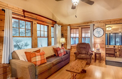 Three Lakes Cabin | Lakeside cabin with a firepit, sunroom, & seasonal dock
