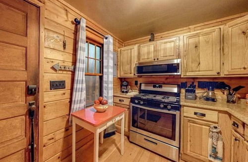 Three Lakes House | Lakeside cabin with a firepit, sunroom, & seasonal dock