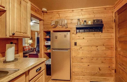Three Lakes House | Lakeside cabin with a firepit, sunroom, & seasonal dock