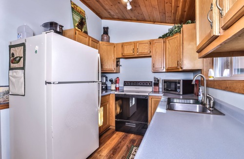 St Germain Cabin | Lakeside resort cabin right on Little Saint with dock, sandy beach, firepit!