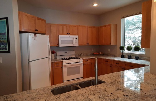 Bellaire Condo | LOCATION LOCATION! Golfers Paradise & ski in/out on the 18th green Cedar River
