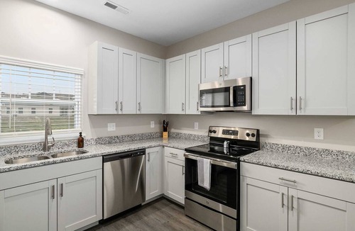 Grandville Condo | Modern New Build 2BR 2BA Condo w Garage and Patio