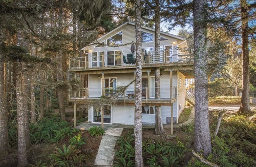 Cape Meares House | Peaceful 4BR Cape Meares Home | Ocean Views, Forest Setting, Wraparound Deck + King Bed