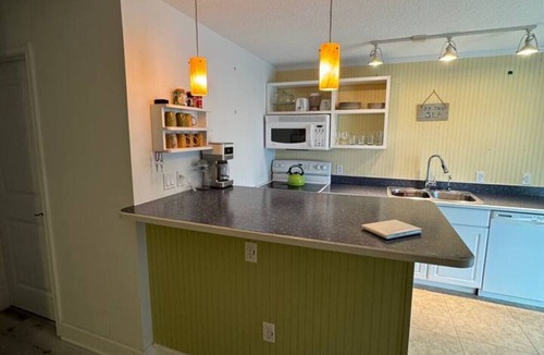 Cocoa Beach Villa | Penguins on the Beach | 2BR Steps to Beach & Downtown w/pool | Unit 2