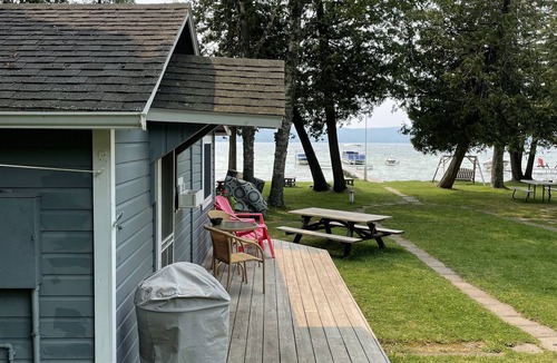 Honor Cottage | Platte Lake Waterfront Cottage with beach and swimming dock