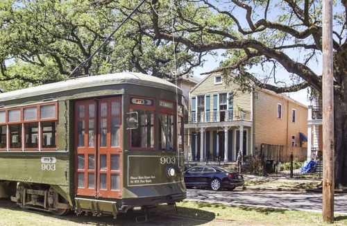 Faubourg Livaudais Condo | PRIVATE COURTYARD! ST.CHARLES AVE! GARDEN DISTRICT!