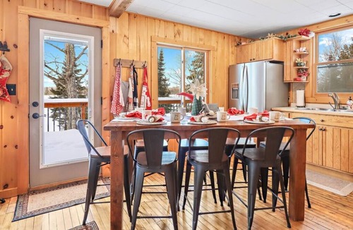 Presque Isle Cabin | Private Lakefront Stay with Beautiful Sunset Views, Kayaks, & Kid’s Area