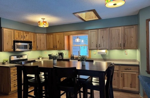 Amery Cabin | Private riverfront cabin with wooded hiking trails