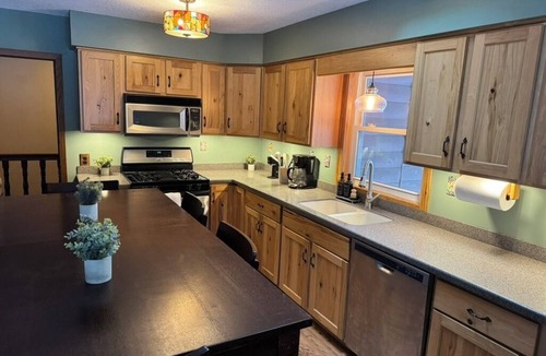 Amery Cabin | Private riverfront cabin with wooded hiking trails
