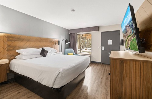 Orchard District Hotel | Relax and Recharge! 3 Comfortable Units! Enjoy Pool Access and Parking On-Site!