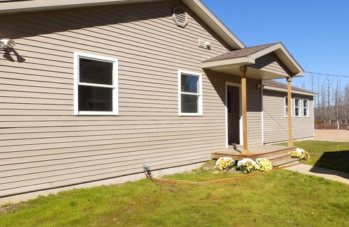 Lake Manuka House | Relax at a newly restored lakefront home with a sandy beach and calm waters.