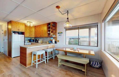 Langley House | Relaxing Beachfront Retreat with Panoramic Water Views and Spacious Outdoor Deck