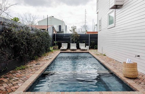 Lower Garden District House | Remodeled Magazine Oasis | Shared Heated Pool+Spa