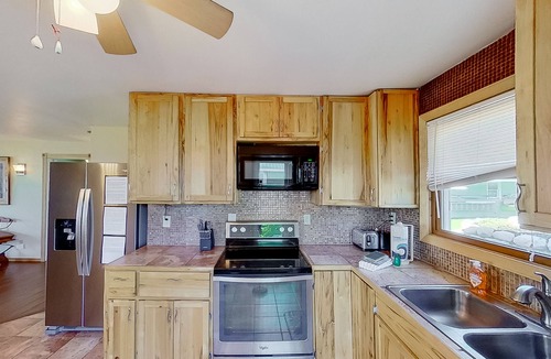 Onekama House | Remodeled, waterfront home on Portage Lake with dock & firepit - 2 dogs OK