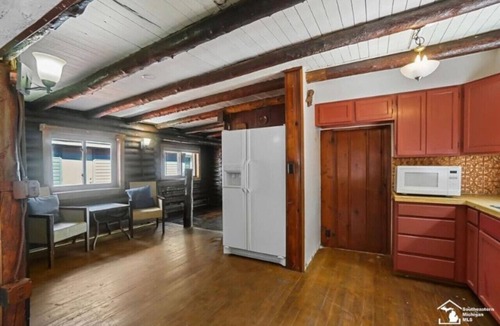 Luna Pier Cabin | Restored historic log cabin and deck on Lake Erie