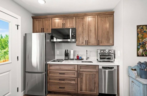 Riverside Condo | RiverWest Hunters Landing - Hot Tub - Riverfront - Dogs
