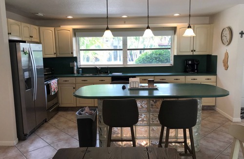 Singer Island House | Single open-concept home one block from the ocean with heated pool and lanai