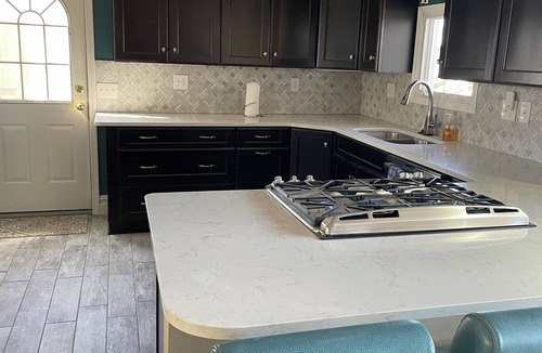 Brighton House | Spacious 4BR Lakefront Home with dock, deck, wifi, AC, & large yard in Brighton
