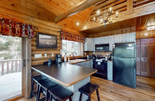 Presque Isle Cabin | Spacious and beautiful lakefront log home on 7 acres with private dock