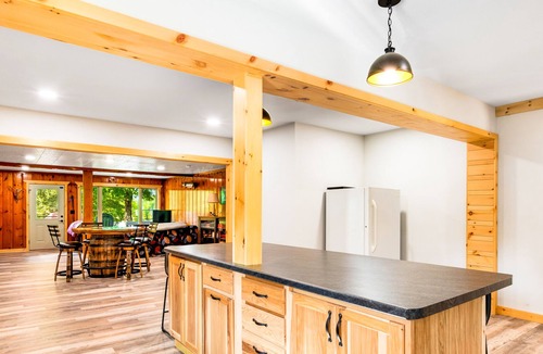 Presque Isle Cabin | Spacious lakefront lodge with fireplaces, WiFi, W/D, dock, & resort game room