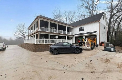 South Lyon House | Spacious Riverfront Retreat With Wraparound Porch And Room For The Whole Team