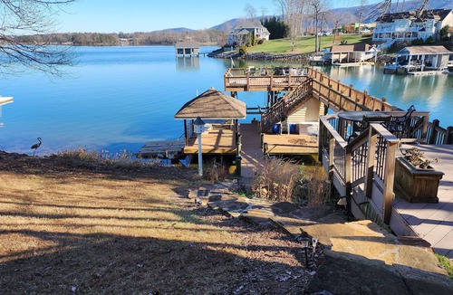 Penhook House | Stunning lake front with private dock and pontoon boat available for rent