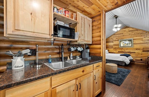 Pickens Cabin | Stunning Riverfront Log Cabin Nestled Amidst Trees in Nashoba, Oklahoma
