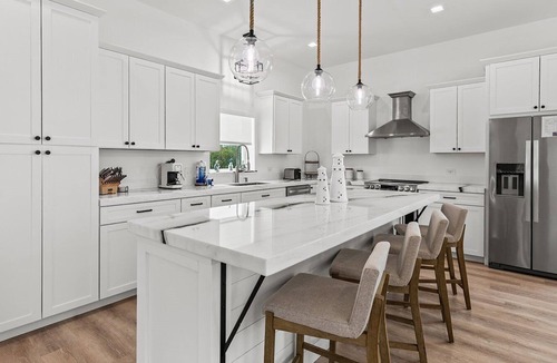 Coury House | Sunshine Getaway in Kcb Luxury Pool Home, 3BR · 3BA · Heated Pool · Bikes · Foosball · Outdoor TV · Pet-Friendly