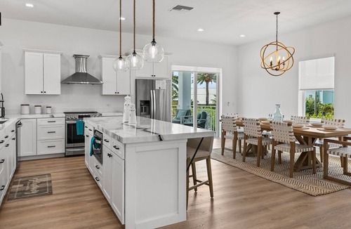 Coury House | Sunshine Getaway in Kcb Luxury Pool Home, 3BR · 3BA · Heated Pool · Bikes · Foosball · Outdoor TV · Pet-Friendly