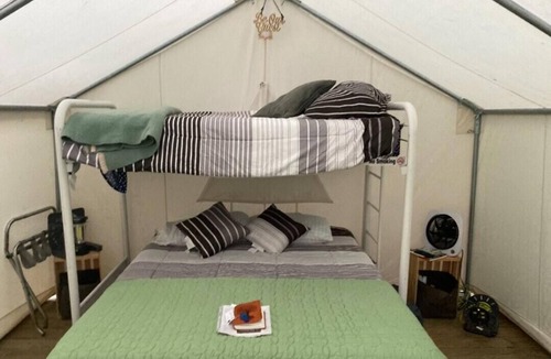 Grawn RV Rental | Tentrr Signature Site - Pine Meadows - Coleman Cooking Site