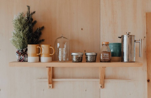 Liberty Cabin | Tiny cabin amongst trees on a farm with alpacas