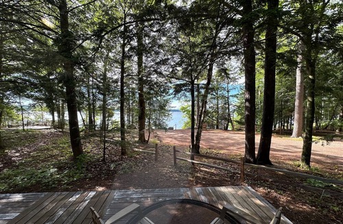 Alden Cottage | Torch lake waterfront:100 ft of sandy beach, 3-bedroom, 3-bath cottage