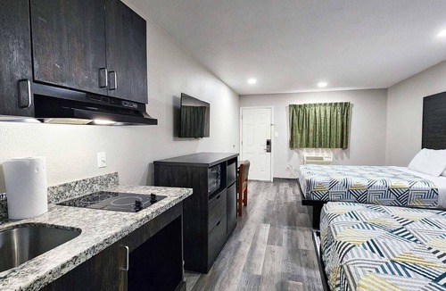 Wharton Hotel | Two Queen Beds Kitchenette Non-Smoking Room at Scottish Inns and Suites!