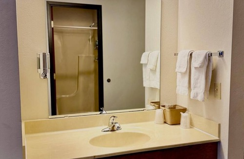 Boulder Junction Apartment | Two queen beds, private bathroom, jetted tub, mini fridge, and single-serve coffee maker.